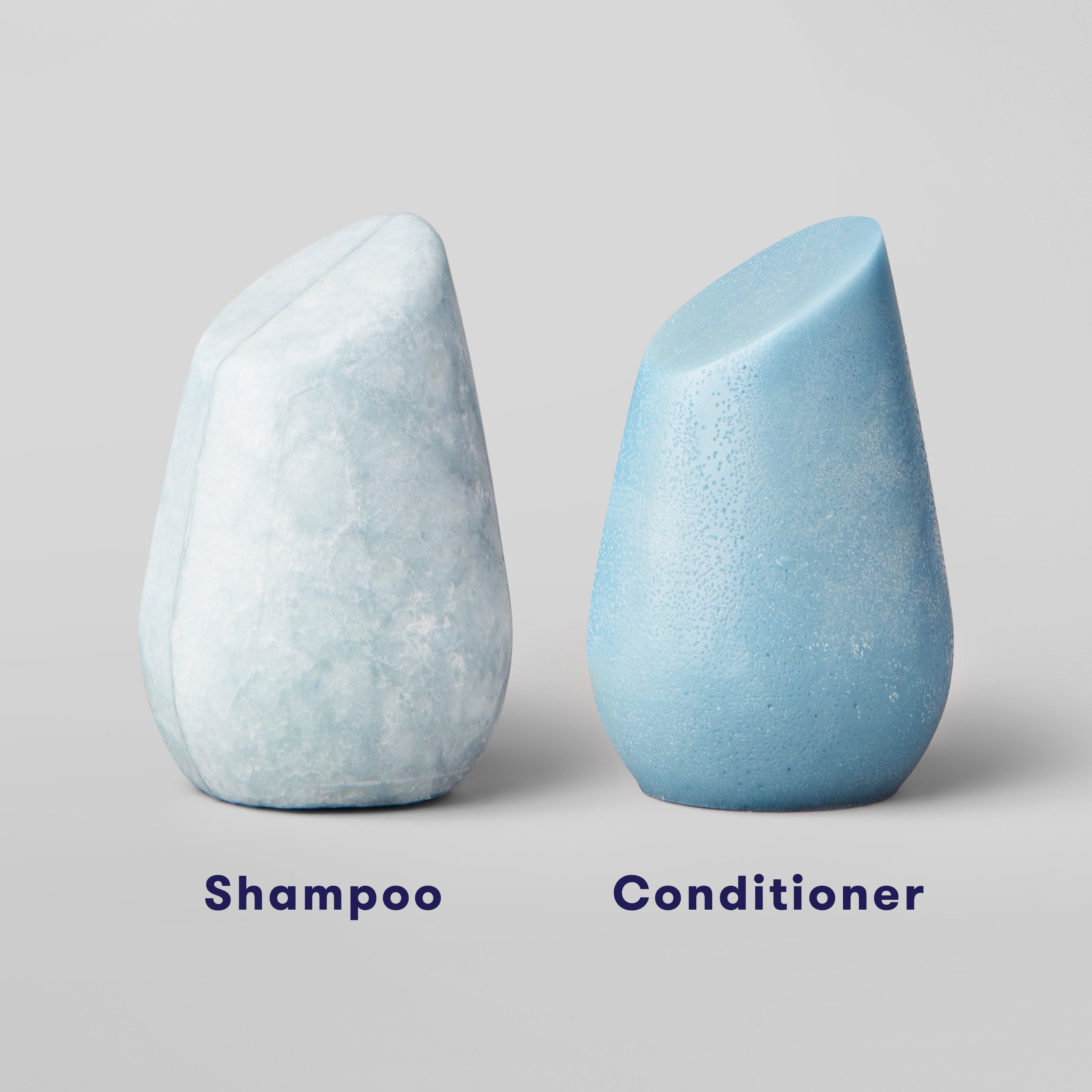 Shampoo bar sitting next to conditioner bar to show the color difference between the two.