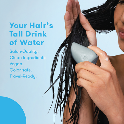 Person using conditioner bar with text about salon-quality, clean, vegan formula, color-safe, and travel-ready product on a blue background.