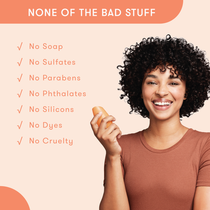 Model holding HiBAR conditioner bar in her hand with a list of bad things that are not in HiBAR. No soap. No sulfates. No parabens. No phthalates. No silicons. No dyes. No cruelty.