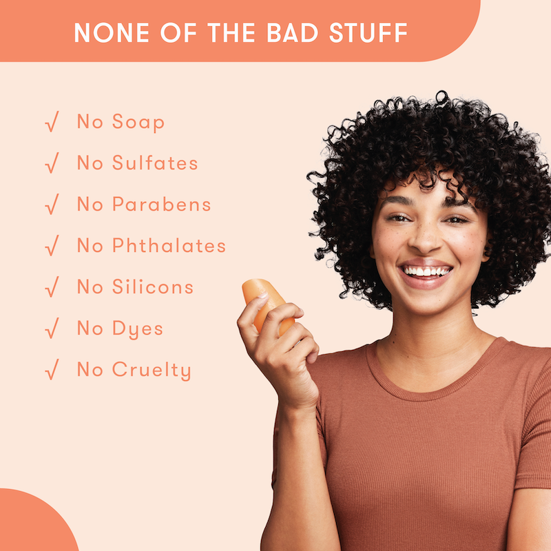 Model holding HiBAR conditioner bar in her hand with a list of bad things that are not in HiBAR. No soap. No sulfates. No parabens. No phthalates. No silicons. No dyes. No cruelty.