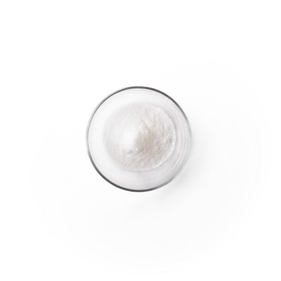 salicylic acid in a glass dish. It is a white colored powder.